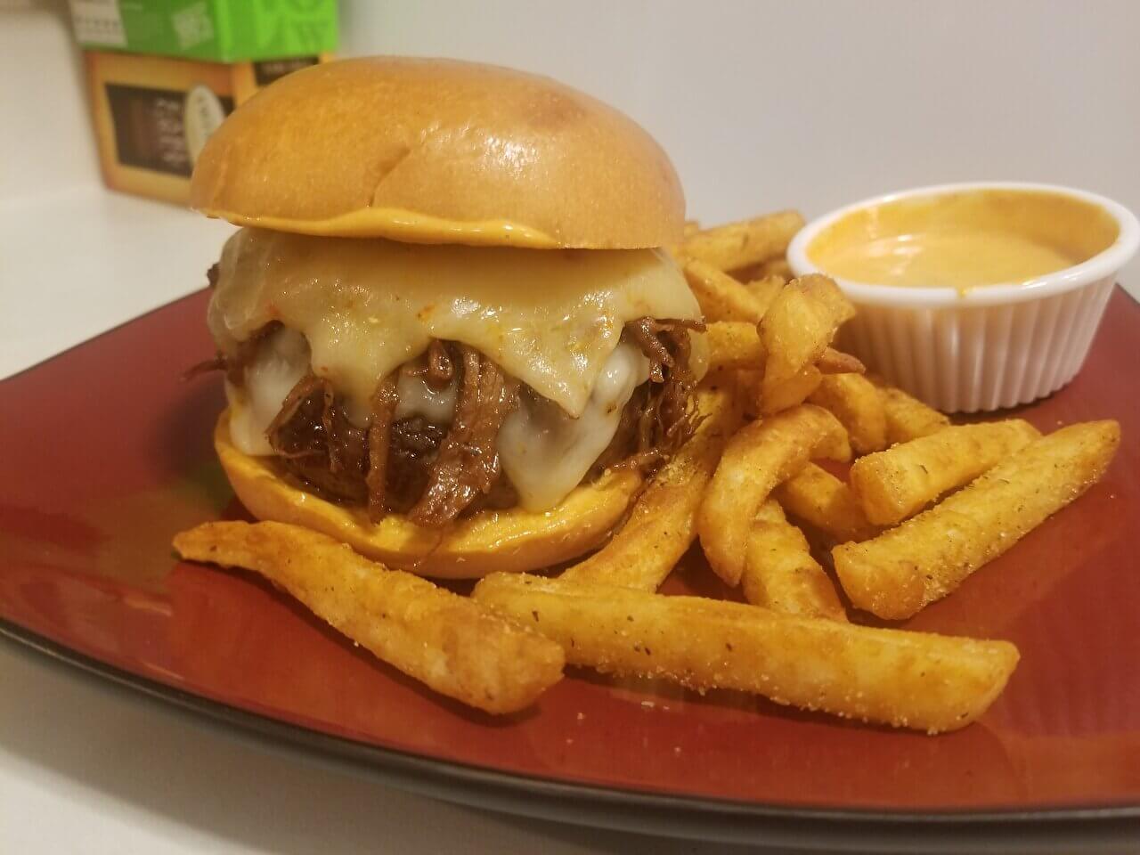 Barbecue bourbon burger with pulled pork and Carolina reaper pepper cheese